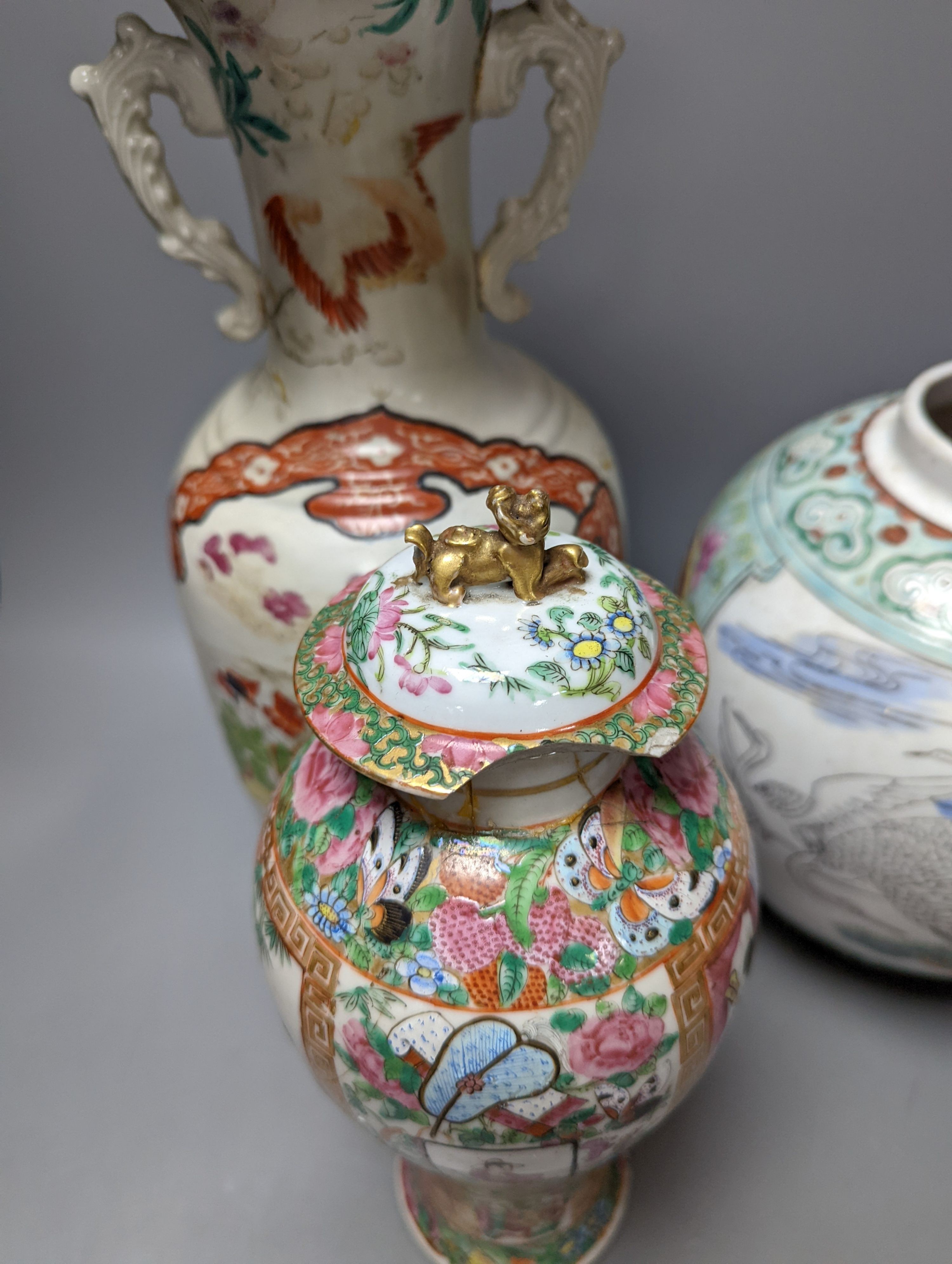 A Chinese famille rose vase and two ginger jars, together with a Japanese vase, 38cm